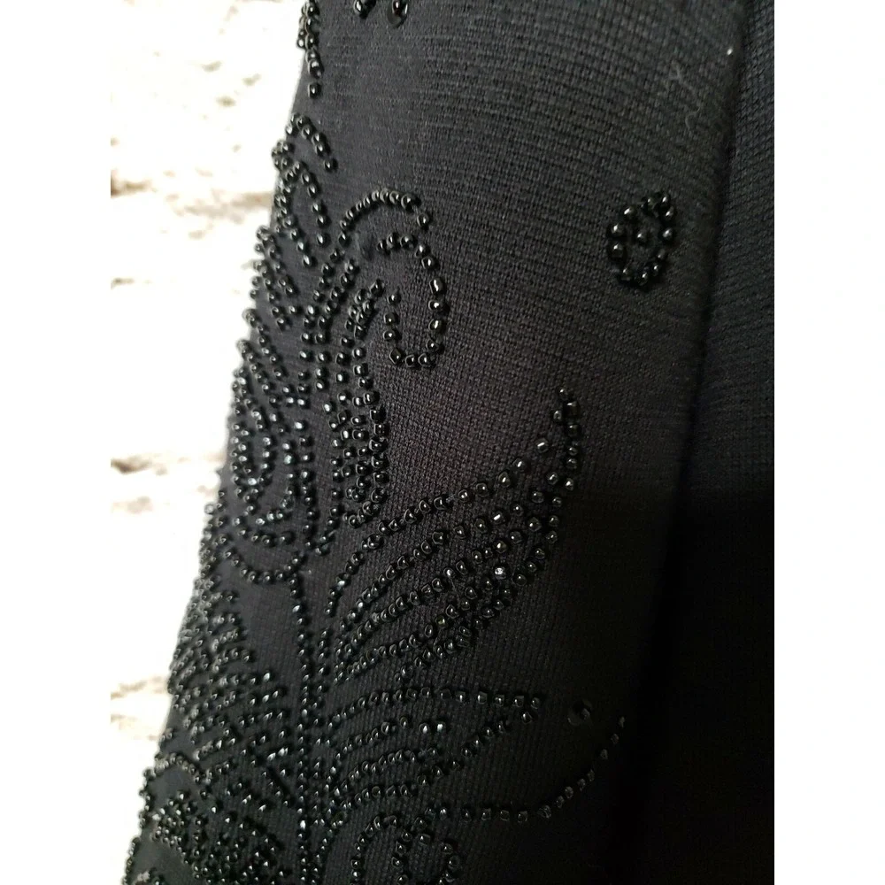 Woman's Theomiles  Black sweater with beaded sleeves sz M